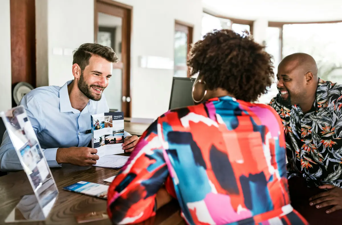 A travel agent reviewing trip options with clients
